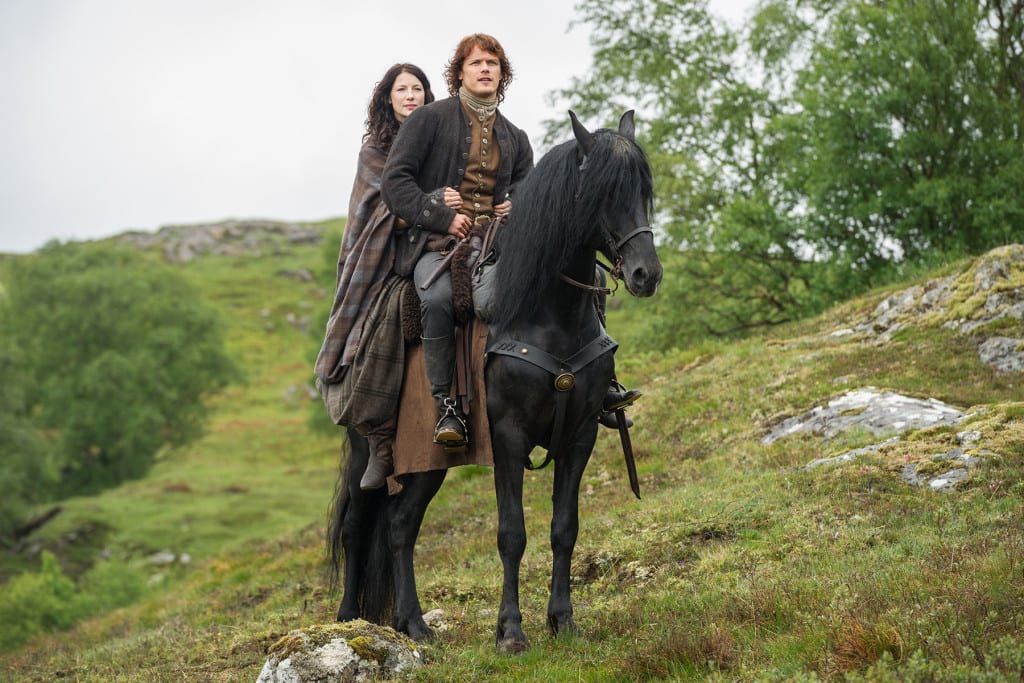 Caitriona Balfe and Sam Heughan (Claire Randall Fraser and Jamie Fraser)